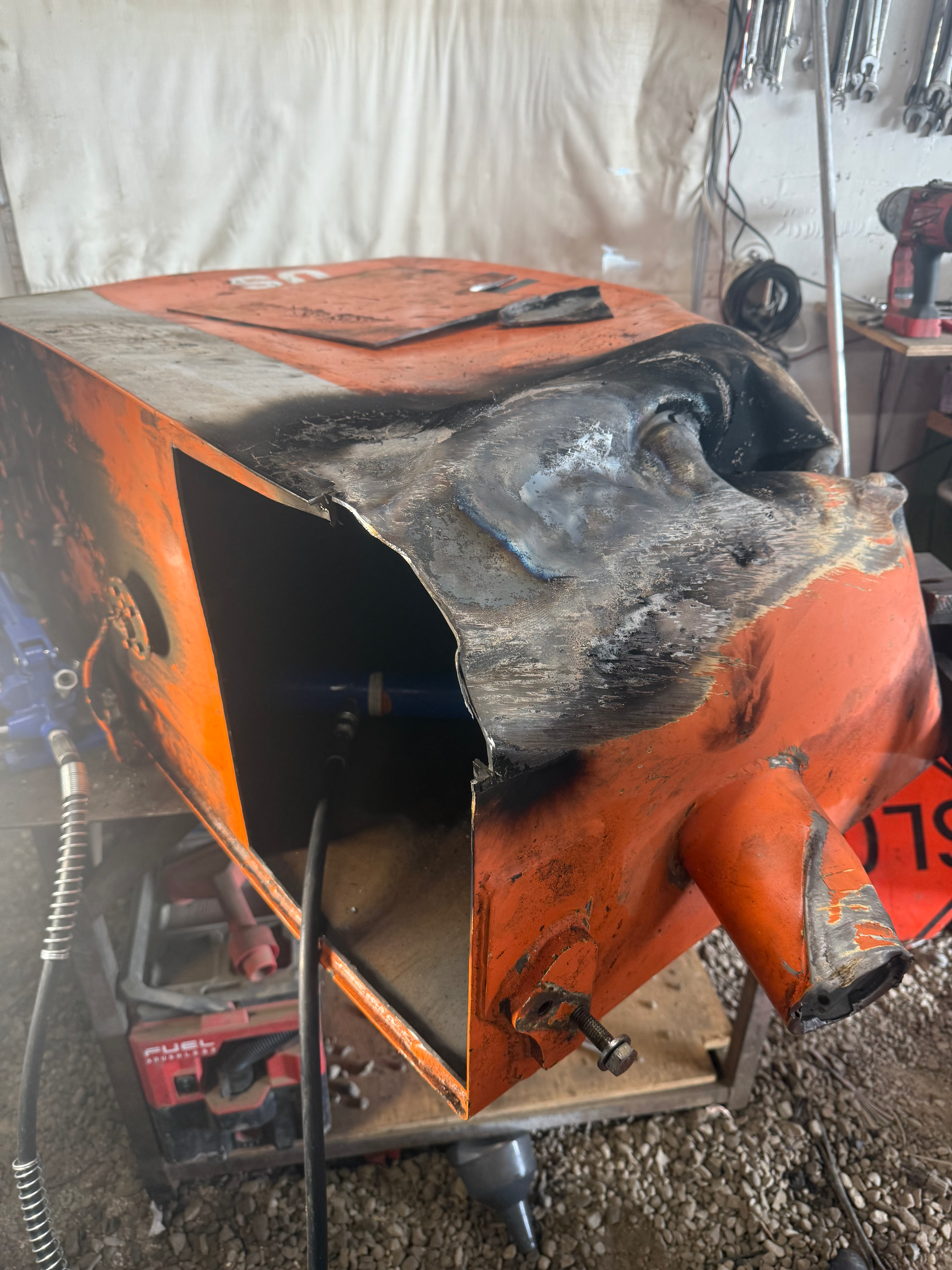 Technician performing equipment repair welding